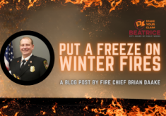 Photo of Fire Chief surrounded by flames and image text