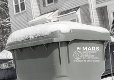 Automated waste cart with snow on lid